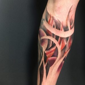 Tetování ve stylu blackwork, watercolor. Motiv abstrakce. Střední kérka.